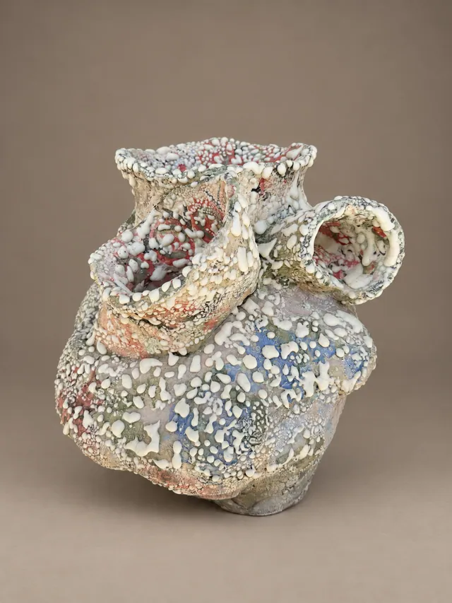 Heart-shaped vessel in textured white, red and blue glaze