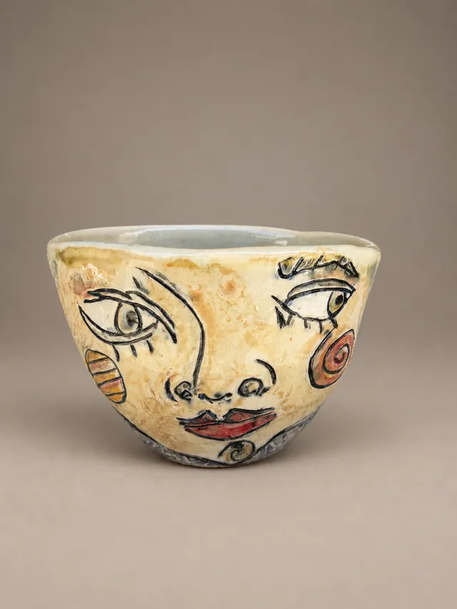 Bowl painted with a woman's face