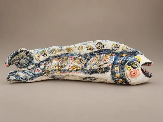 Long fish sculpture with gold and blue decoration