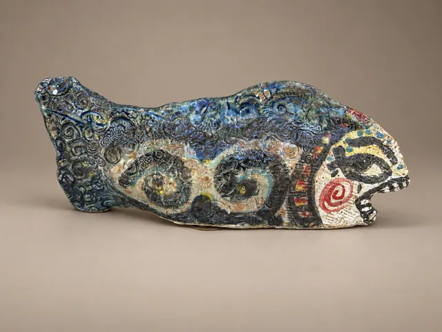 Fish sculpture with blue spirals